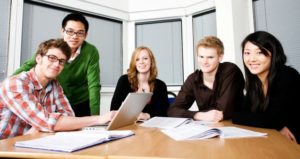By: Claire Howell Major, PhD Add Comment Enter the term “group work” into a Google search, and you’ll find yourself bombarded with dozens of hits clustered around definitions of group work, benefits of group work, and educational theories underpinning group work. If you dig a little deeper into the search results, however, you’ll find that not all of the pages displayed under the moniker of “group work” describe the same thing. Instead, dozens of varieties of group learning appear. They all share the common feature of having students work together, but they have different philosophies, features, and approaches to the group task. Does it matter what we call it? Maryellen Weimer asked this important question in her 2014 Teaching Professor article of the same title, with the implicit idea that one approach might be better suited for a given task than another. She believes that the answer to the question is yes. And she’s right. As the adage goes, it is important to choose the right tool for the job at hand. A hammer is not the best tool for drilling a hole, and a drill is not the best tool for driving a nail. Both are good tools, when used for the appropriate job. While there are several different forms of group work, there are a few that are more often used than others and have a body of research that supports their effectiveness. So it is with group work. If you don’t choose the best possible approach, then you will be less likely to accomplish the goals and objectives of the assignment. While there are several different forms of group work, there are a few that are more often used than others and have a body of research that supports their effectiveness. Three of these are cooperative learning, collaborative learning, and reciprocal peer teaching. Cooperative learning: In this form of group learning, students work together in a small group so that everyone participates on a collective task that has been clearly assigned (Cohen, 1994, p. 3). A classic example of this approach is Think-Pair-Share (Barkley et al, 2014), in which the teacher assigns a question and then students think for a minute independently, form a pair to discuss their answers, and share their answers with a larger group. The goal is that all students achieve similar outcomes. Each student considers the same teacher-assigned question, and they all work on performing the same tasks: thinking, pairing, and sharing. Collaborative learning: In this form of group learning, students and faculty work together to create knowledge. The process should enrich and enlarge them (Matthews, 1996, p. 101). An example of this form of group work is a collaborative paper (Barkley et al, 2014). In a collaborative group, students work together to create a product that is greater than any individual might achieve alone. They do not all necessarily do the same task, however, but rather may divide the work among themselves according to their interests and skills. The goal is not for the same learning to occur, but rather that meaningful learning occurs. Reciprocal peer teaching: In this form of group learning, one student teaches others, who then reciprocate in kind (Major et al, 2015). Arguably, this approach is a variation of either cooperative learning or collaborative learning, depending on the task. An example that leans more toward cooperative learning is the jigsaw, in which base groups study together to become experts (Barkley et al, 2014). The base groups then split, and new groups are formed with a member of each base group serving as an expert in a particular area. An example that leans more toward collaborative learning is microteaching, in which individual students take turns teaching the full class (Major et al, 2015). These three approaches are all tried-and-true group-learning varieties. They all have been shown to benefit students on a number of outcomes, from the acquisition of content knowledge to the development of higher-order thinking skills (Davidson & Major, 2015). How is it possible, then, to choose the right pedagogical tool for the learning task? Pedagogical considerations: In choosing any approach to group learning, it is essential to start with the learning goal. What should students be able to do after the completion of the activity? If the goal is for them all to gain the same information, cooperative learning may be the best approach. If the goal is for them to create new knowledge, then collaborative learning may be the best approach. If it is to share knowledge, reciprocal peer teaching may be a good approach. Learner considerations: When making any pedagogical consideration, it is essential to consider the students. Their level of expertise is important, for example, and if they are new to a subject and need foundational knowledge, then cooperative learning may be the best approach. If they are advanced students, then collaborative learning or reciprocal peer teaching may be more engaging for them. Contextual considerations: While contextual considerations are not always the most glamorous, they certainly play a part in our ability to carry out group work. For example, if the class is a large one, a short collaborative activity such as a Think-Pair-Share may simply be more manageable than a long-term collaborative activity; likewise, reciprocal microteaching may be a great approach in an online class but would not be as feasible in a large lecture scenario. A collaborative paper might be a great way to introduce graduate seminar students who work as research assistants at a flagship university to the process of co-authoring, but the same approach might not work as well for first-year students at a community college. The intent here is not to prescribe a specific approach based on a checklist of considerations. Rather, it is to say that, as teachers, we need to know what the instructional options are and to take into account the goals, the learners, and the learning context when making pedagogical decisions. Ultimately, we are in the best place to know what will work best in our unique situations, and it is thus our responsibility to choose well when deciding to use group work in the college classroom. References: Barkley, E.F., Major, C.H., & Cross, K.P. (2014). Collaborative learning techniques: A handbook for college faculty. San Francisco: Jossey-Bass. Cohen, E. G. (1994). Restructuring the classroom: Conditions for productive small groups. Review of Educational Research, 64(1), 1-35. Matthews, R.S. (1996), Collaborative Learning: creating knowledge with students, in Menges, M., Weimer, M. and Associates. Teaching on solid ground, San Francisco: Jossey-Bass. Major, C.H., Harris, M.S., and Zakrajsek. (2015). 101 Intentionally Designed Educational Activities to put students on the path to success. London, Routledge. Weimer, M. (2014). Does it matter what we call it. The Teaching Professor, 28(3), 4. Claire Howell Major is a professor of higher education at the University of Alabama. You can follow her on Twitter @ClaireHMajor. Add Comment Posted in Effective Teaching Strategies Tagged with assignment strategies, collaborative learning, cooperative learning, group work, group work strategies Edit Login Follow the discussion Comments There are no comments posted yet. Be the first one! Post a new comment Enter text right here! Comment as a Guest, or login: Login to IntenseDebate Login to WordPress.com Login to Twitter Name Email Displayed next to your comments. Not displayed publicly. Submit Comment Subscribe to Sign up for our FREE Newsletter! You have our promise not to sell or share your email address — ever! State authorization TOPICS: Academic Leadership Asynchronous Learning and Trends Blended and Flipped Learning Curriculum Development Distance Learning Administration EdTech News and Trends Educational Assessment Effective Classroom Management Effective Teaching Strategies Faculty Development Faculty Evaluation Instructional Design Learning Styles Online Education Philosophy of Teaching Teaching and Learning Teaching Careers Teaching Professor Blog Teaching with Technology Online Classroom newsletter You might also like:
Why Change Our Approach to Teaching? Campus Safety Strategies for Community Colleges Campus Safety Strategies for Community Colleges What Kind of Feedback Helps Students Who Are Doing Poorly? Good Writing Skills Matter in Every Course, Not Just English Composition Academic Affairs and Student Affairs: Bridging the Gap The Power of a Good Question .