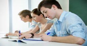 students writing in class