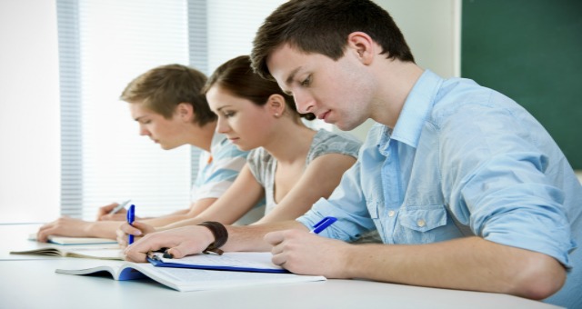 students writing in class