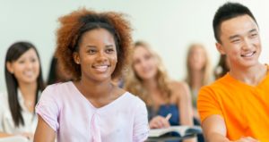 Diverse group of university students in classroom