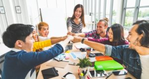 Students work together in the classroom to encourage interdependence