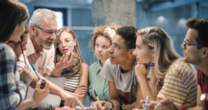 Professor talks to engaged students with unique lesson techniques