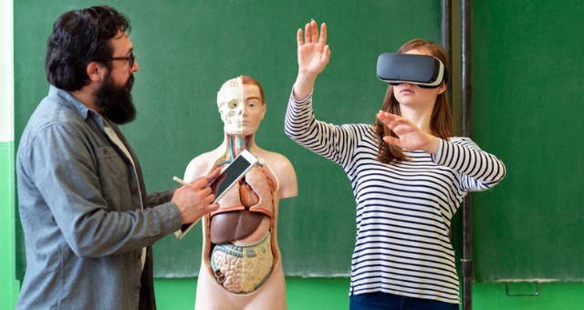 Student has virtual reality headset in classroom