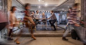 Blurred people move about their day to reflect their busy lifestyles