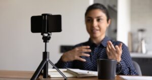 Teacher records herself with video recording device for asynchronous instruction