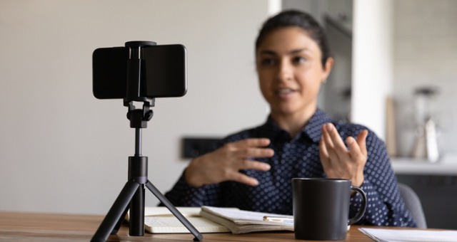 Teacher records herself with video recording device for asynchronous instruction