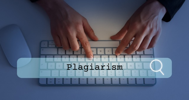 Search icon over keyboard with words "plagiarism" typed