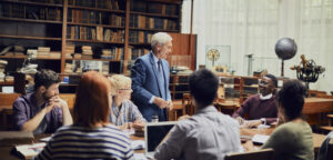 Instructor teaching students in college classroom
