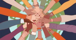 Hands represent diversity all gathered together on top of the world