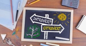 Introvert and extrovert drawn on chalkboard