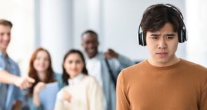 Students bully other student with headphones