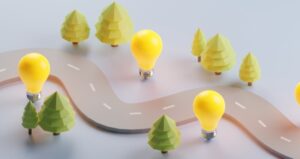 Creative journey process with road, lightbulbs and trees
