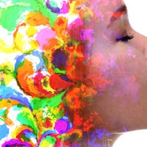 Woman's brain side is filled with colors and imagination